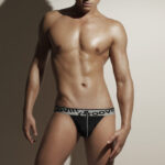 Front view of male model in GROOVIN’ black Jock Strap – bold and supportive men’s underwear with signature waistband